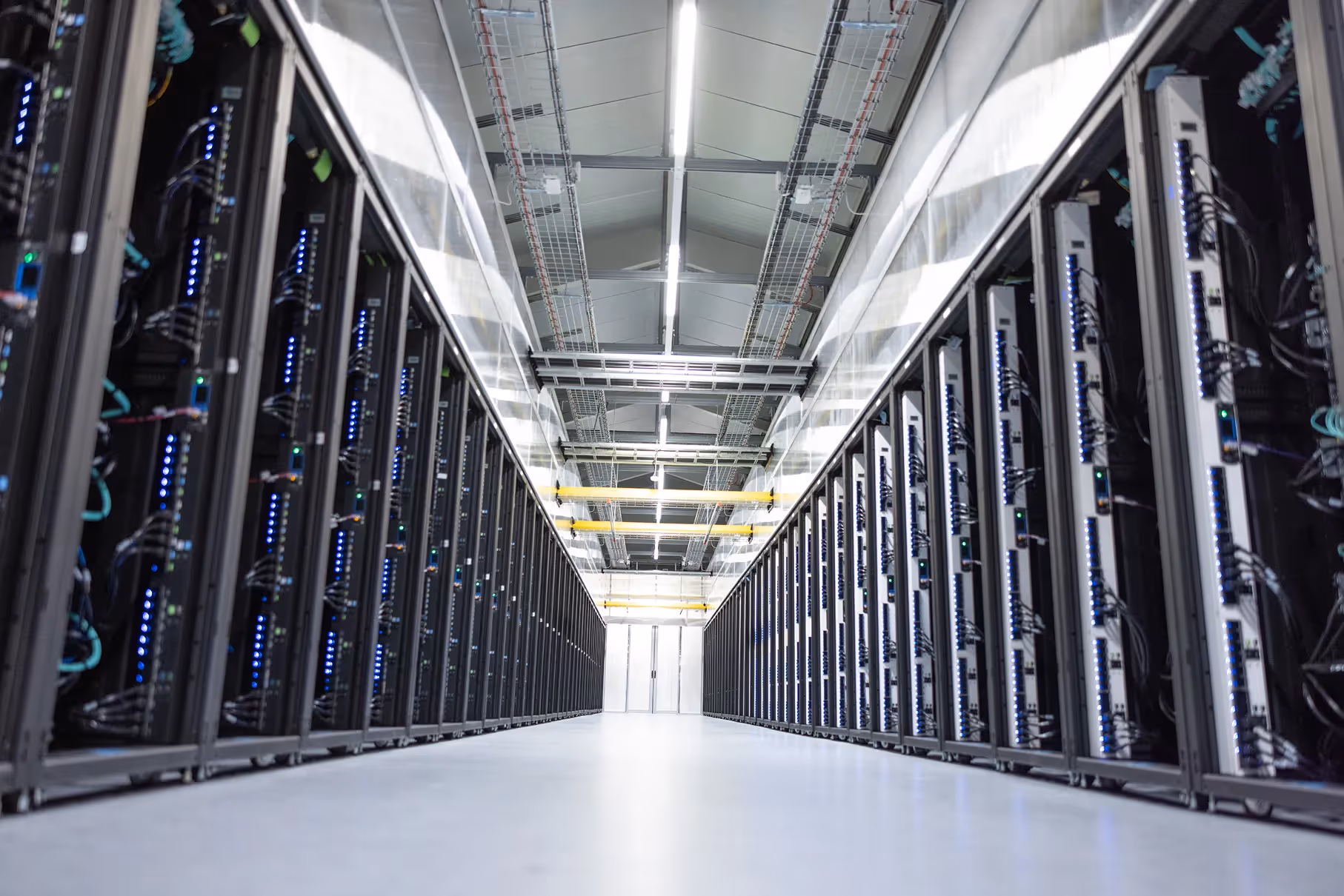 Photograph of data center hallway showcasing GPUs.