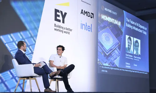 Photo of a conference with Chase Lochmiller, Co-founder and CEO of Crusoe, on stage with an interviewer.