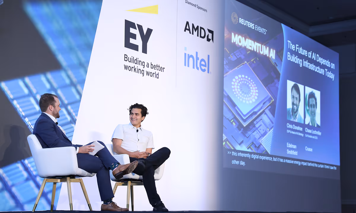 Photo of a conference with Chase Lochmiller, Co-founder and CEO of Crusoe, on stage with an interviewer.