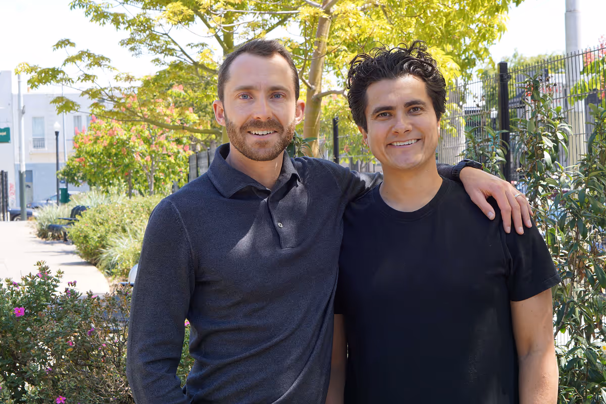 Photo of Crusoe's co-founders, Cully Cavness and Chase Lochmiller, standing together outdoors.