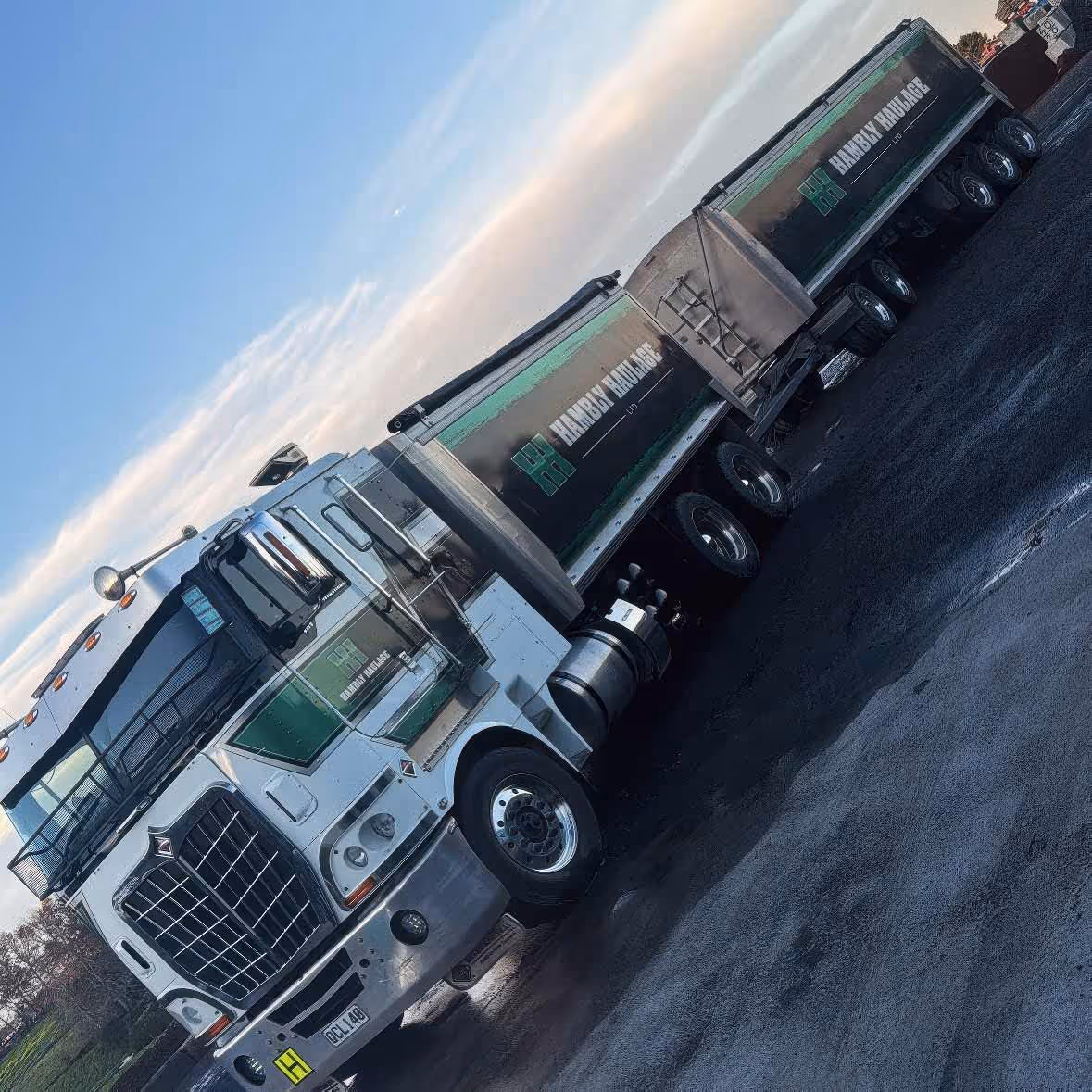 Hambly Haulage truck parked outside with green and white signage clearly visible.