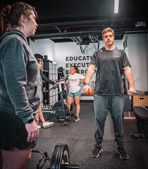pt-showing-patient-exercise---hybrid-performance