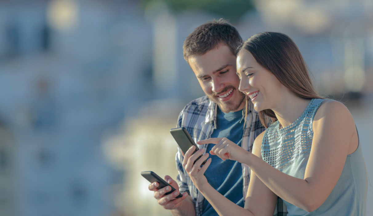 young couple exploring the MOQO App
