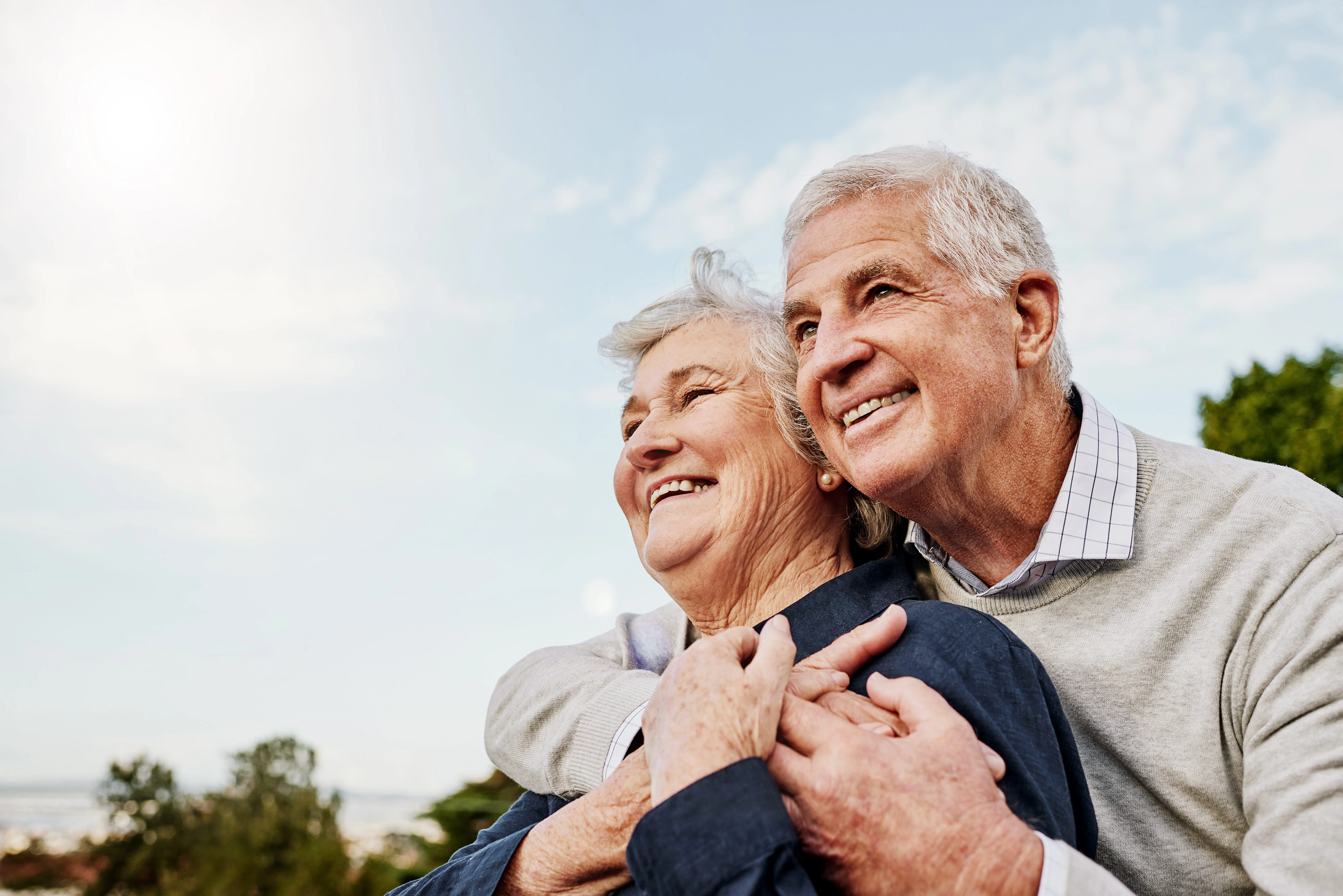 seniors hugging stock image