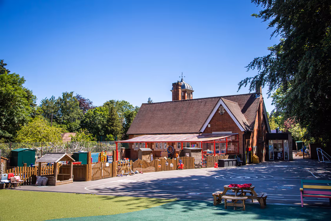 Infant school playground with an out building