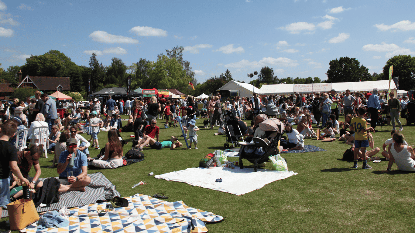 Crowds of people in the sunshine at the Bramley Fete