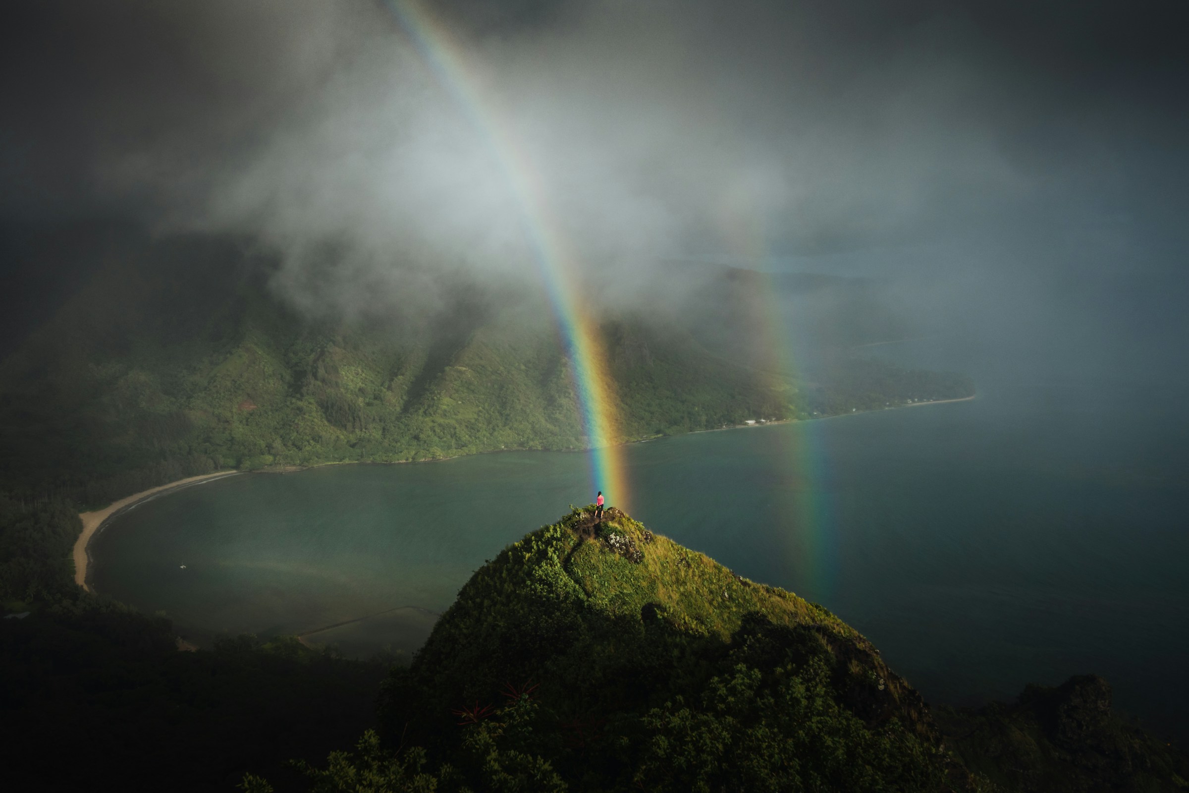 A beautiful rainbow spreads over a Hawaii landscape