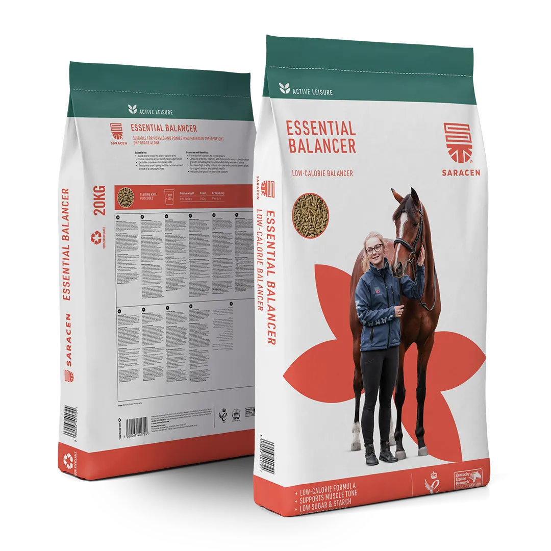 Two bags of Saracen Horse Feeds Essential Balancer low-calorie horse feed, one showing front with a woman standing beside a horse and the other showing nutritional information on the back.