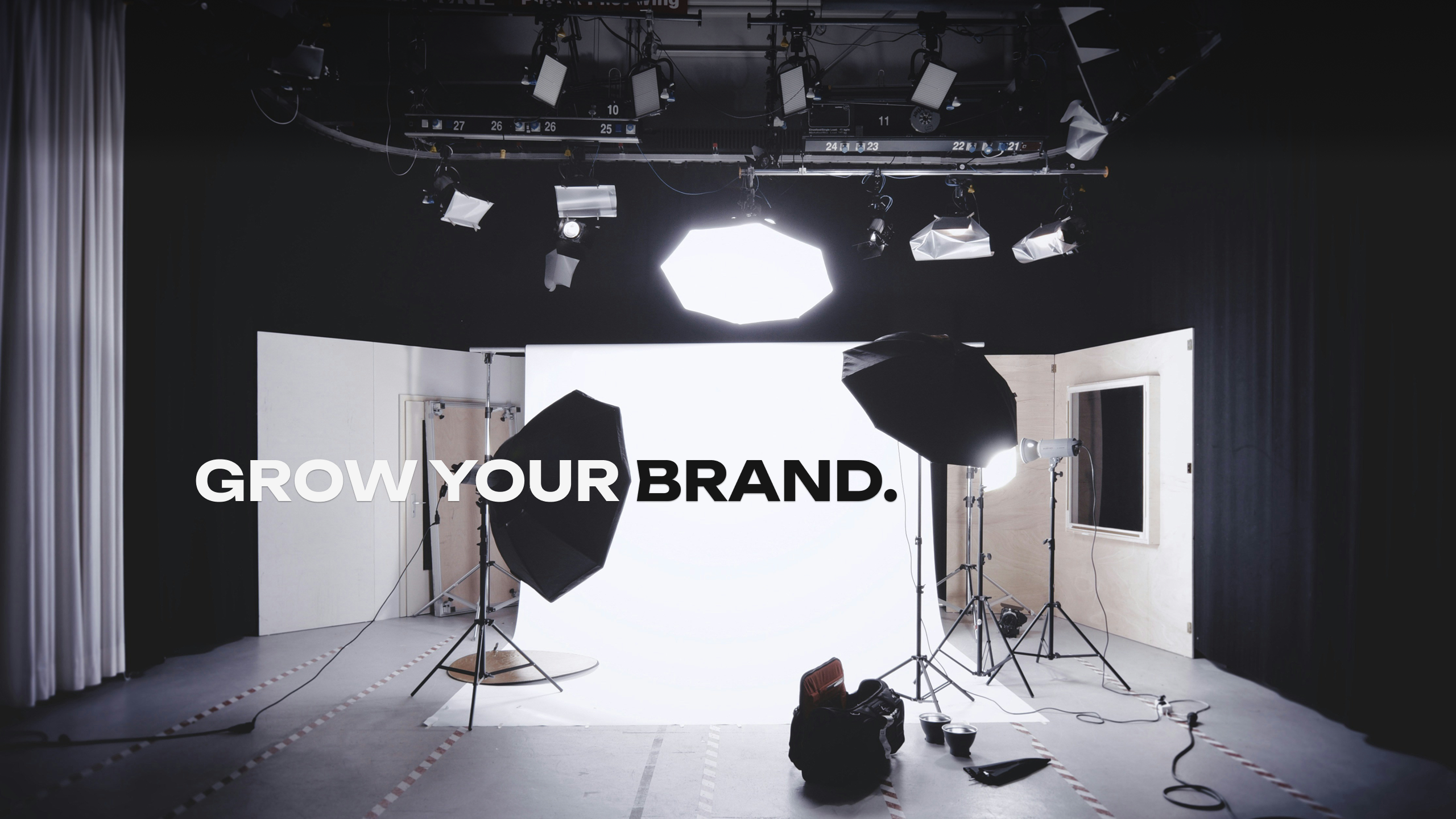 A studio setting with the text "Grow your brand." on it