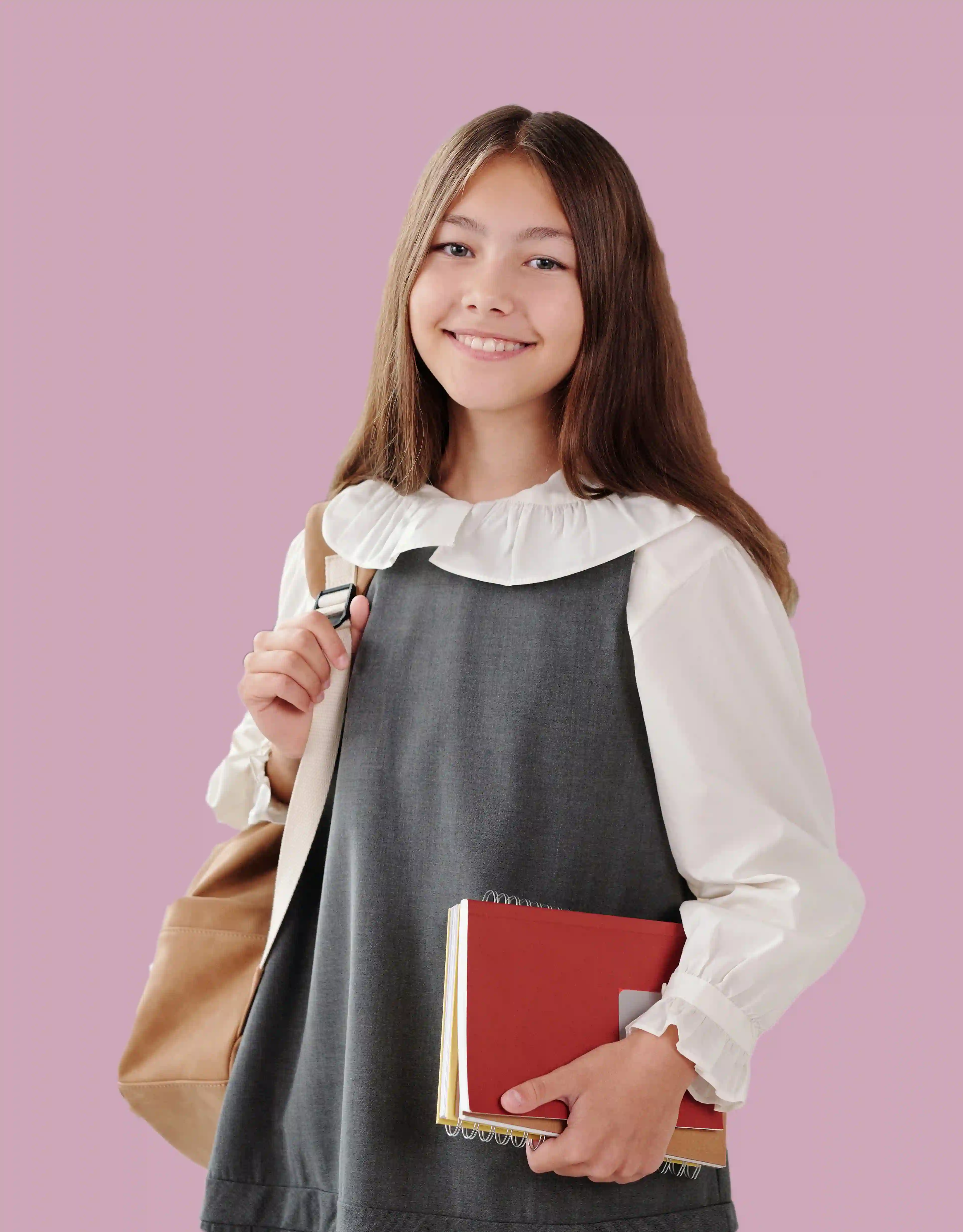 Girl with notebook on pink background
