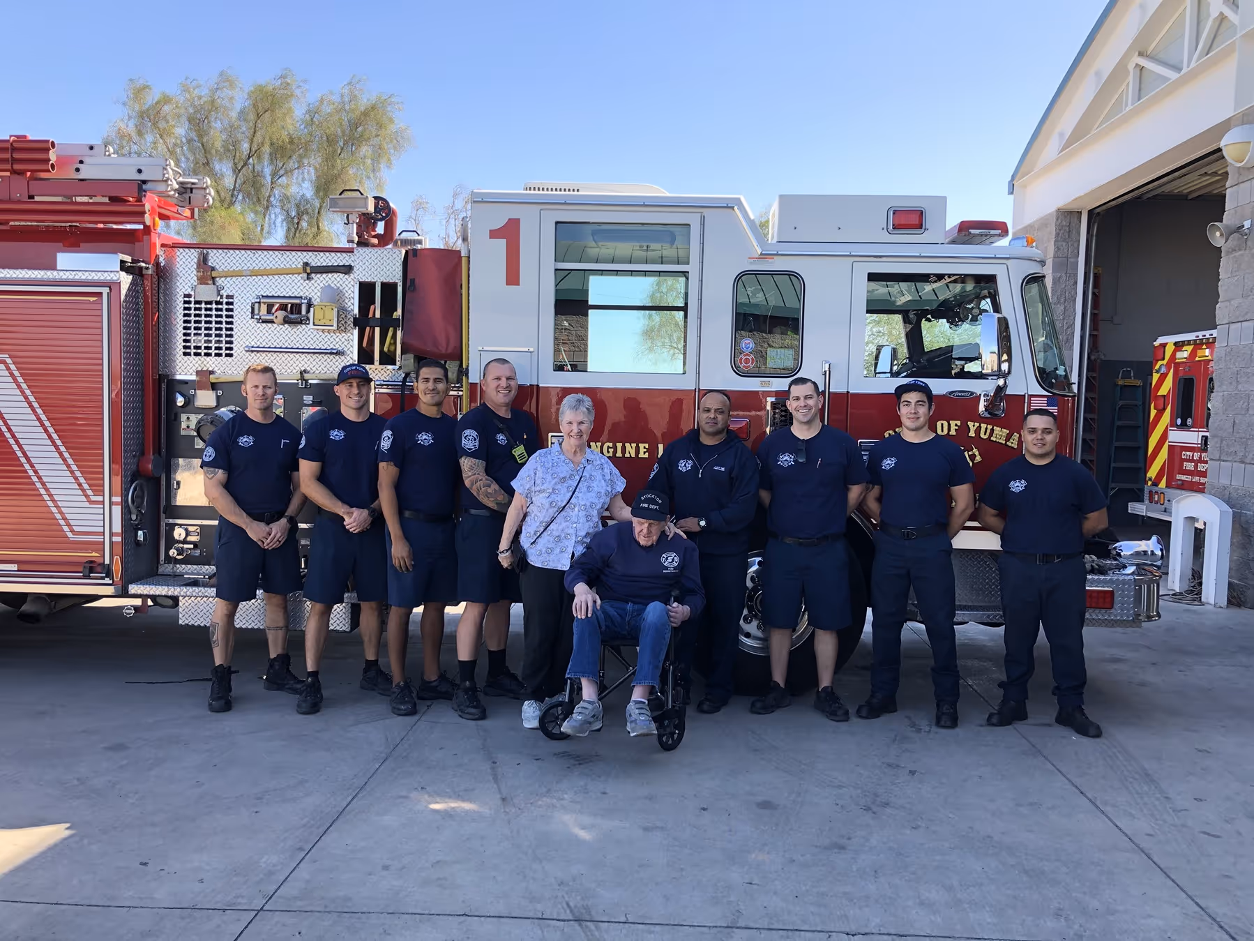 United Yuma firefighters with disabled man, group photo