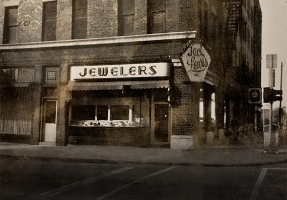 exterior sepia toned photo of the original Jack Lewis Jewelers in downtown Bloomington on the corner of Jefferson