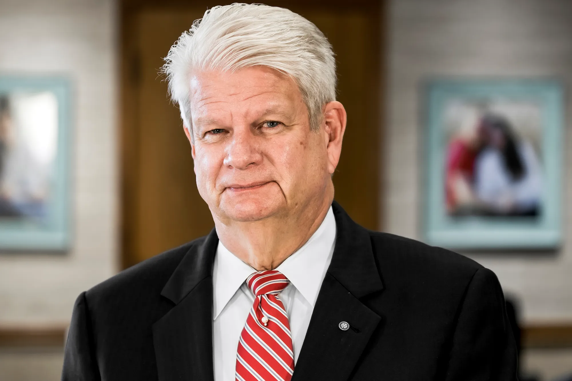 headshot of previous CEO John Wohlwend