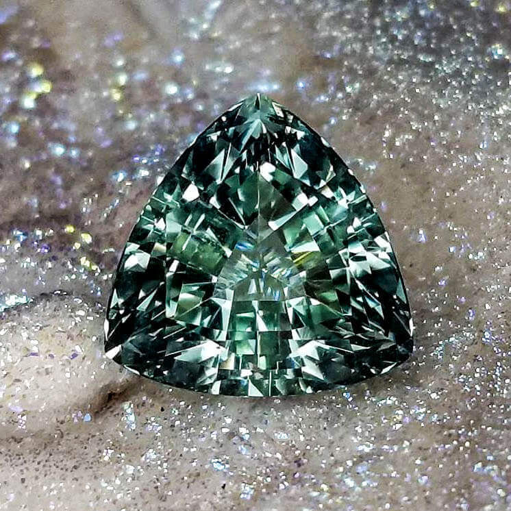green triangle shaped gemstone