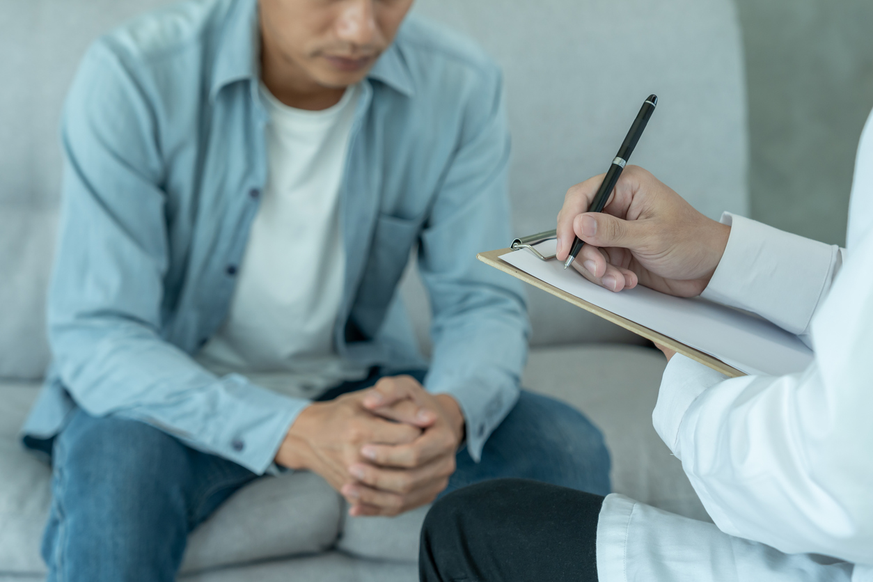 Man speaking to doctor