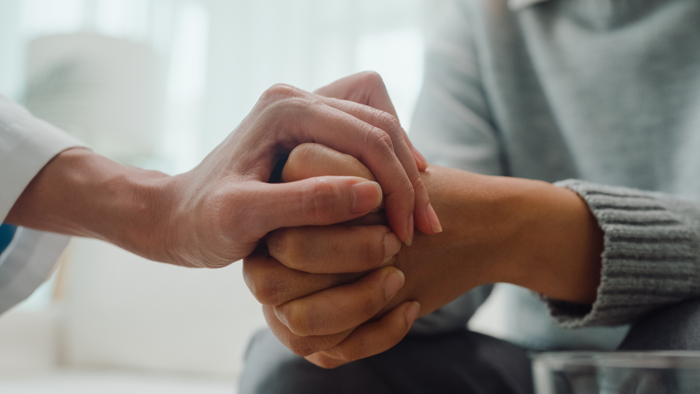 holding hand in care