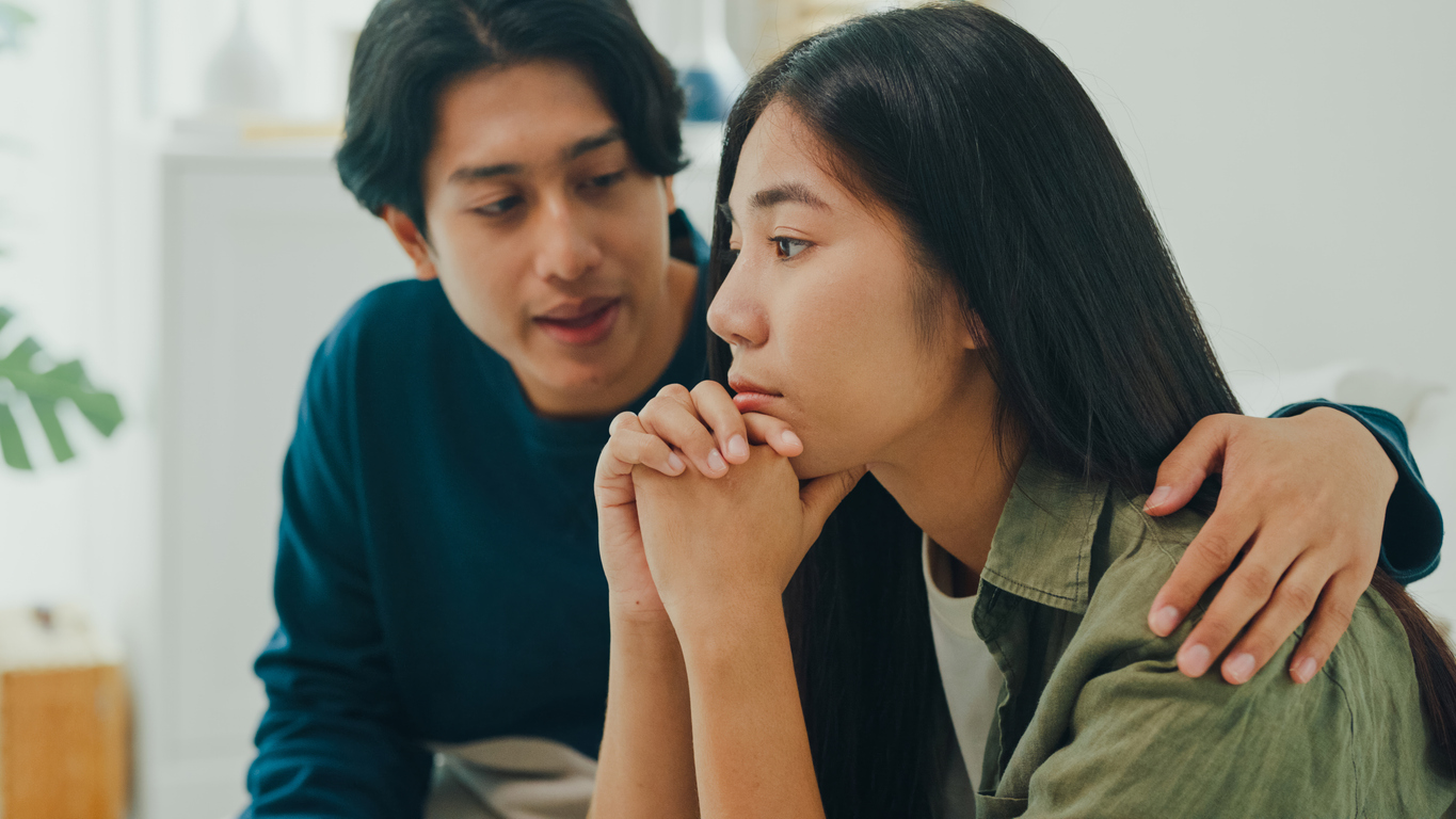 Man comforting a woman
