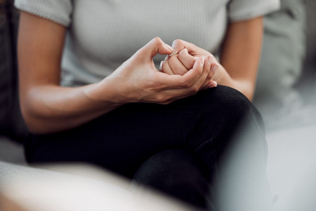 Hands of a seated woman