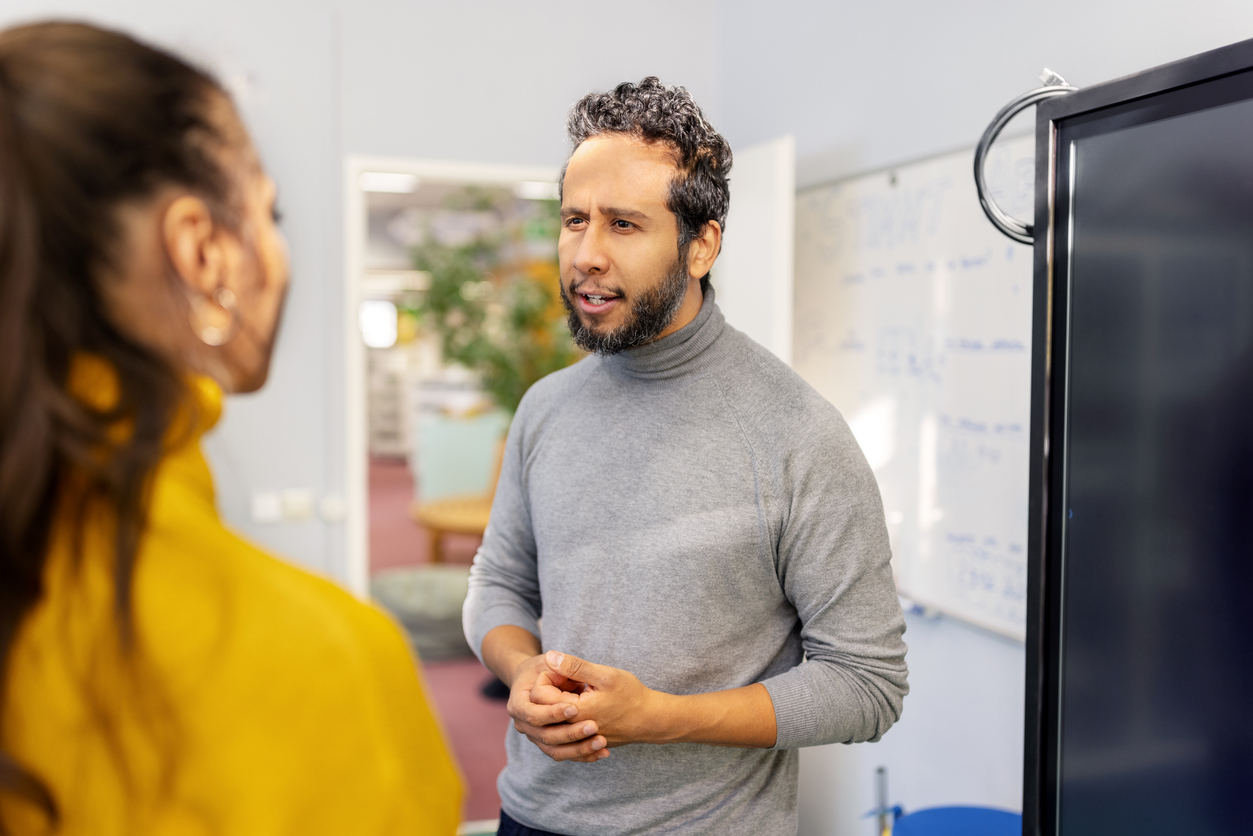Man speaking with a woman