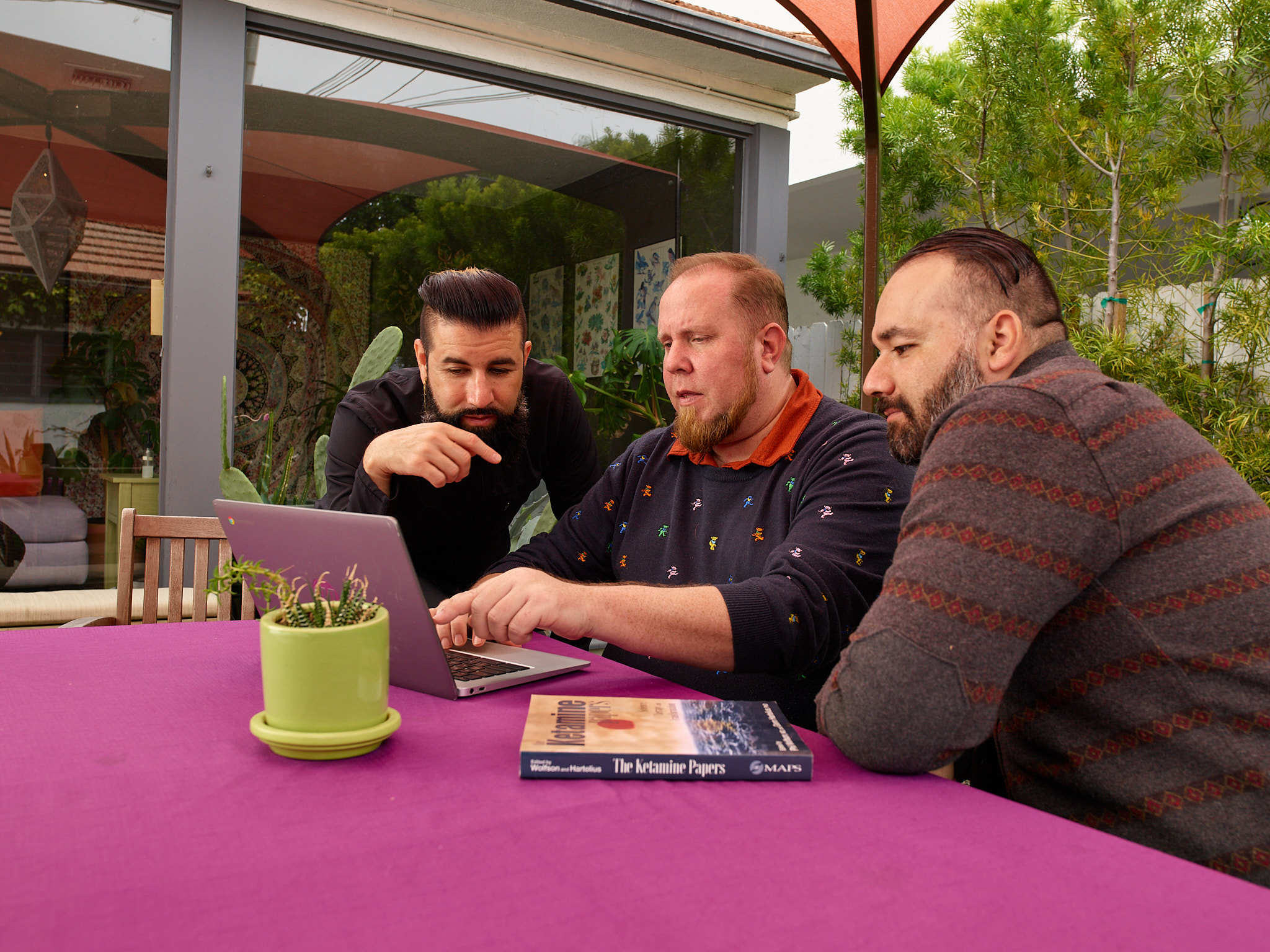 Group looking at a laptop
