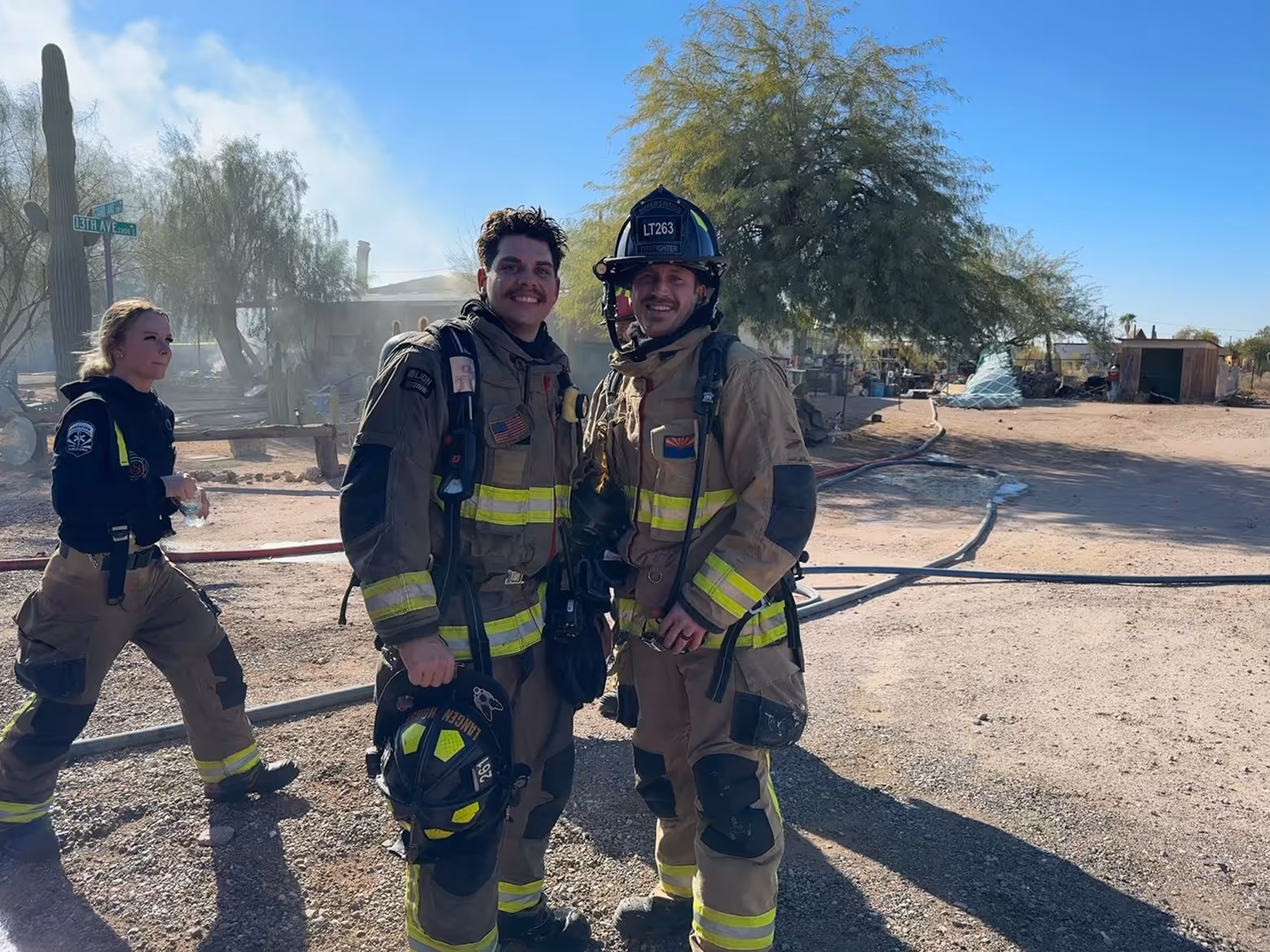 Smiling fire fighters in uniform