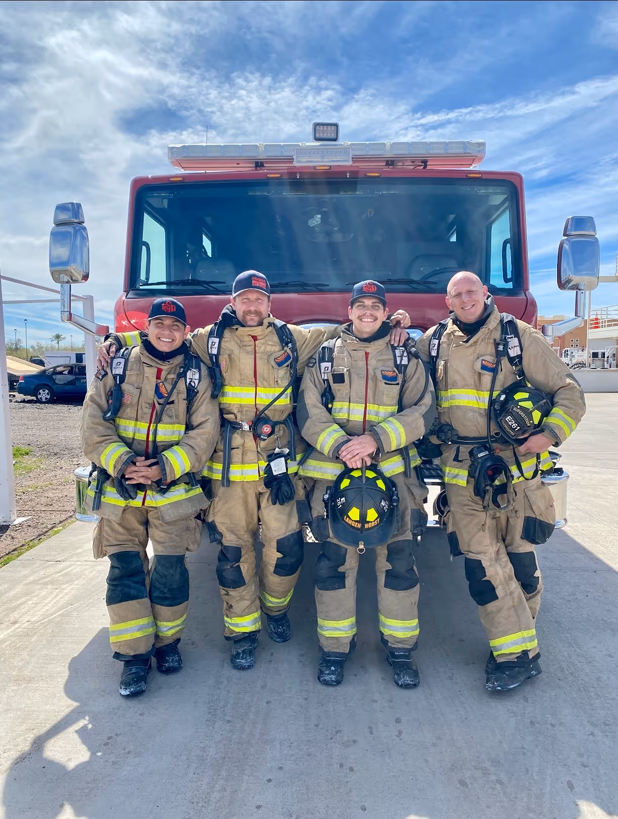 Smiling firefighters in uniform