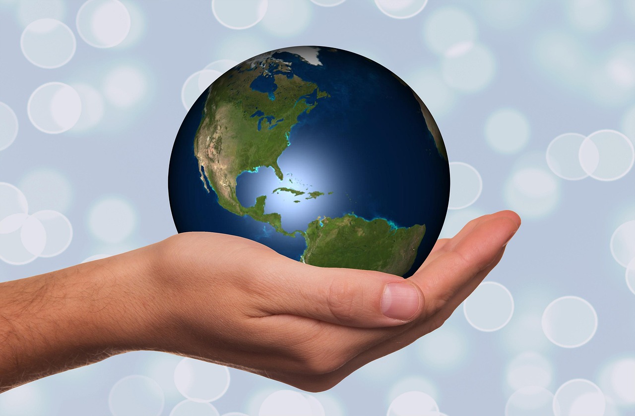 Hand holding a globe