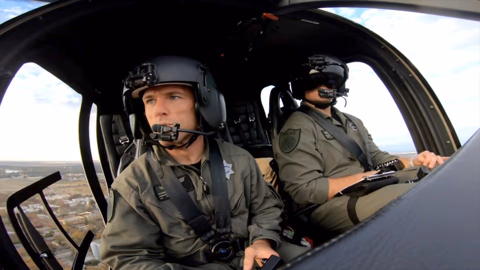 2 male in the helicopter