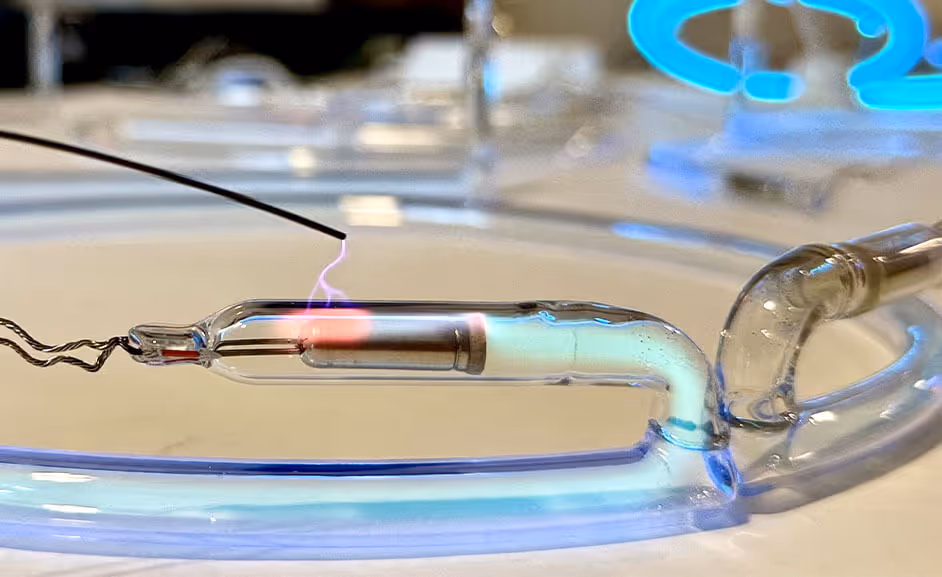 Electrode being tested for a leak. Arcing to tester.