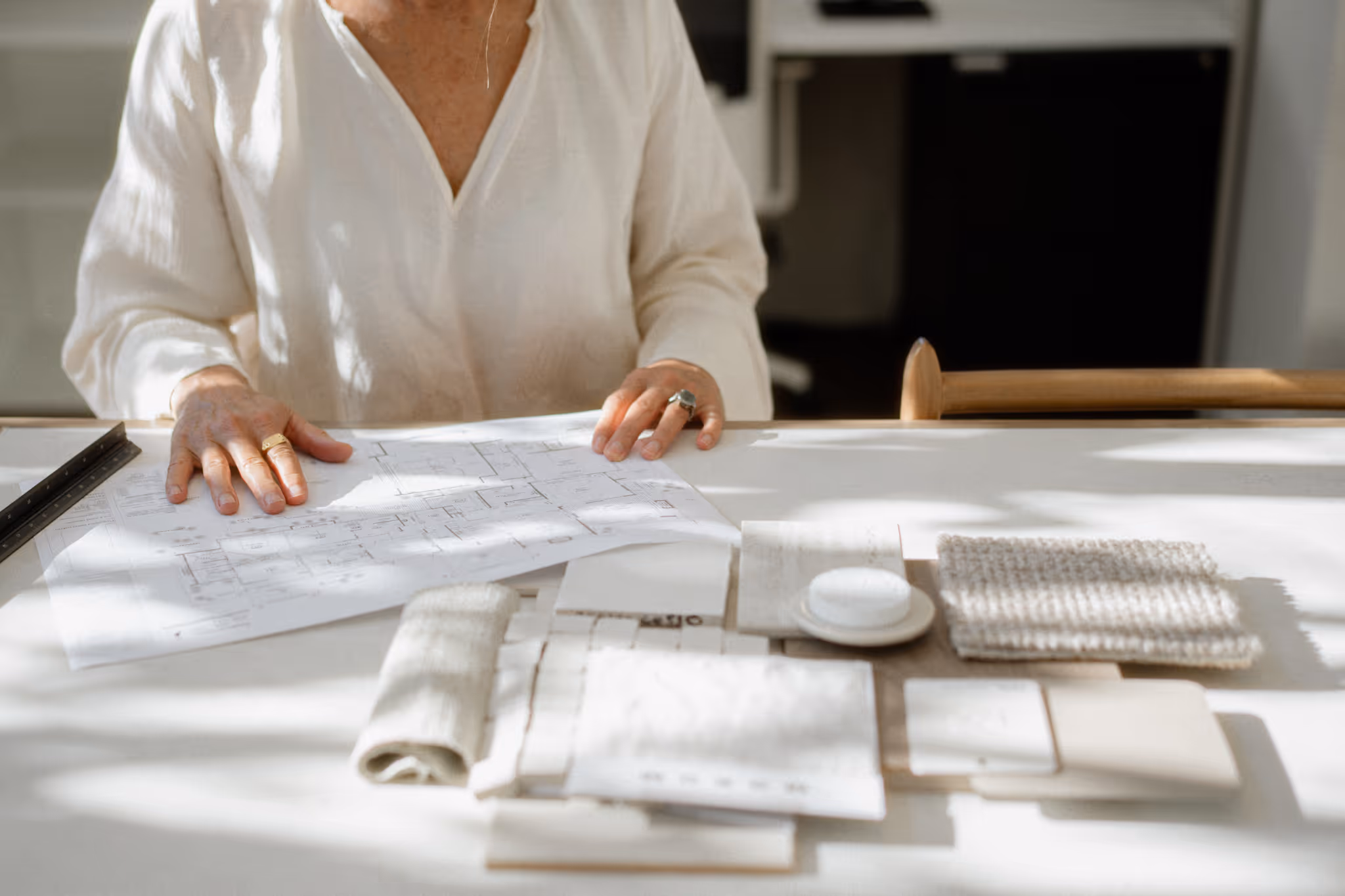 Woman looking at samples of interiors.