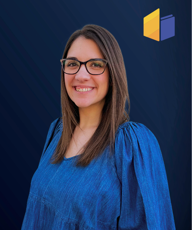Smiling woman with glasses and long brown hair wearing a blue top on a dark background with logo.