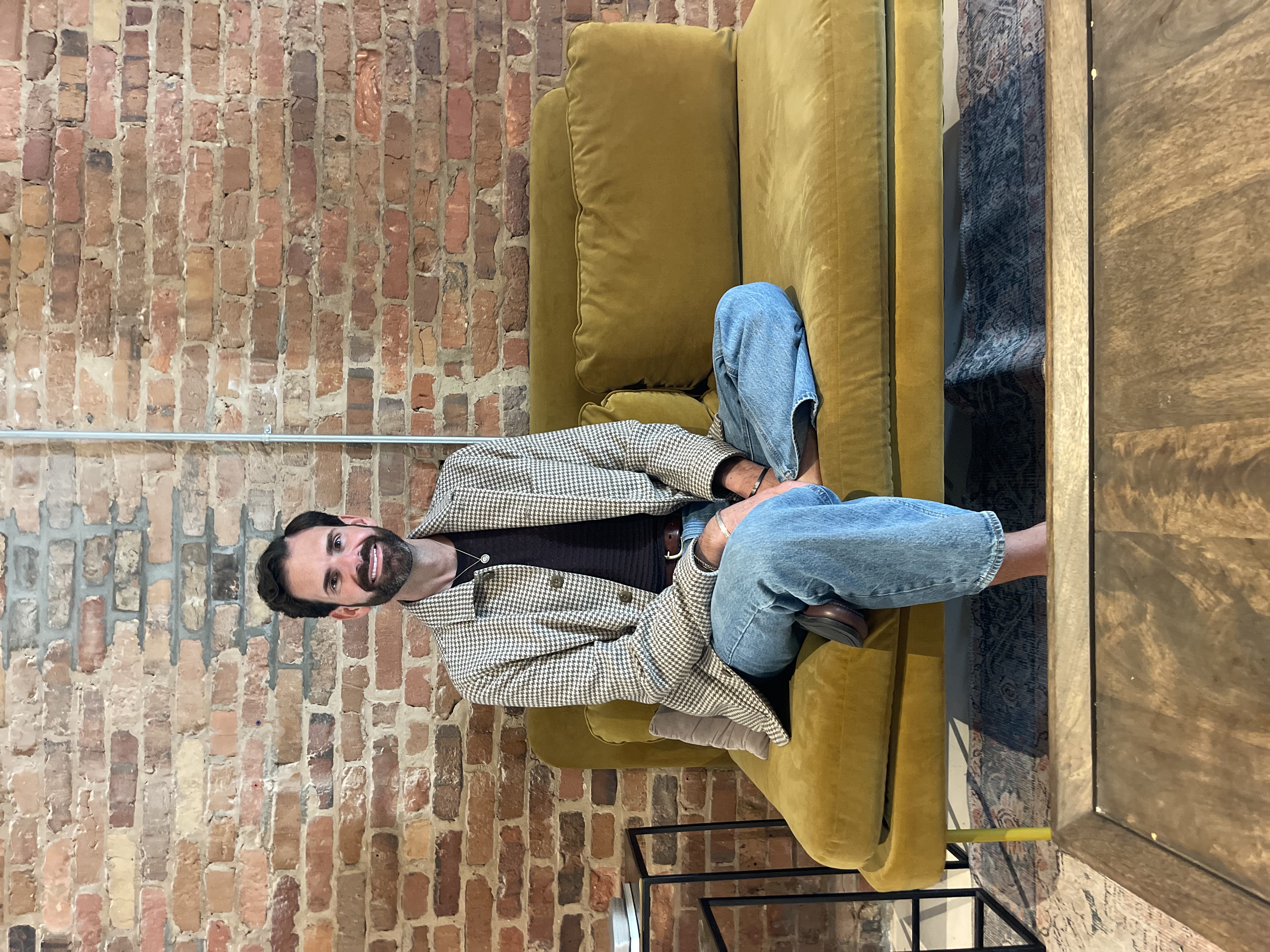 Dr. Lucas Hall seated for a professional portrait