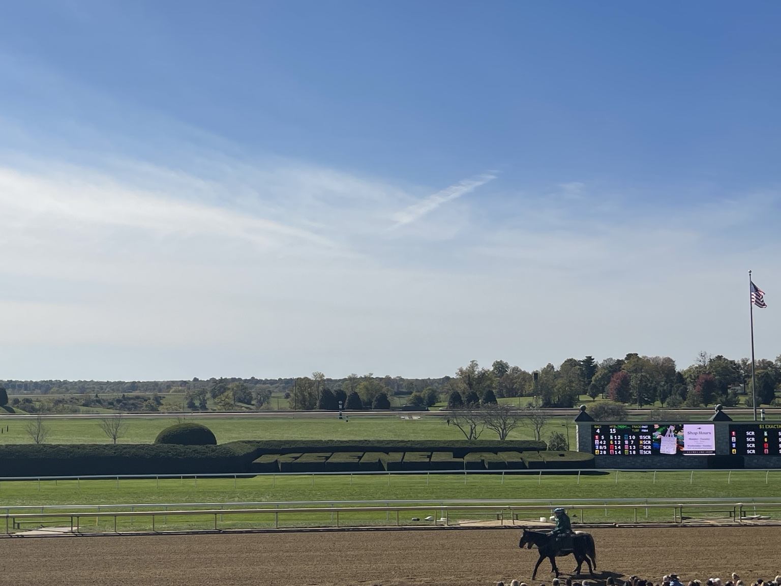 Keeneland racetrack and Kentucky landscape beneath a blue sky