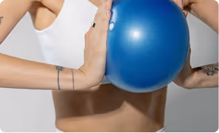woman doing pilates with a ball