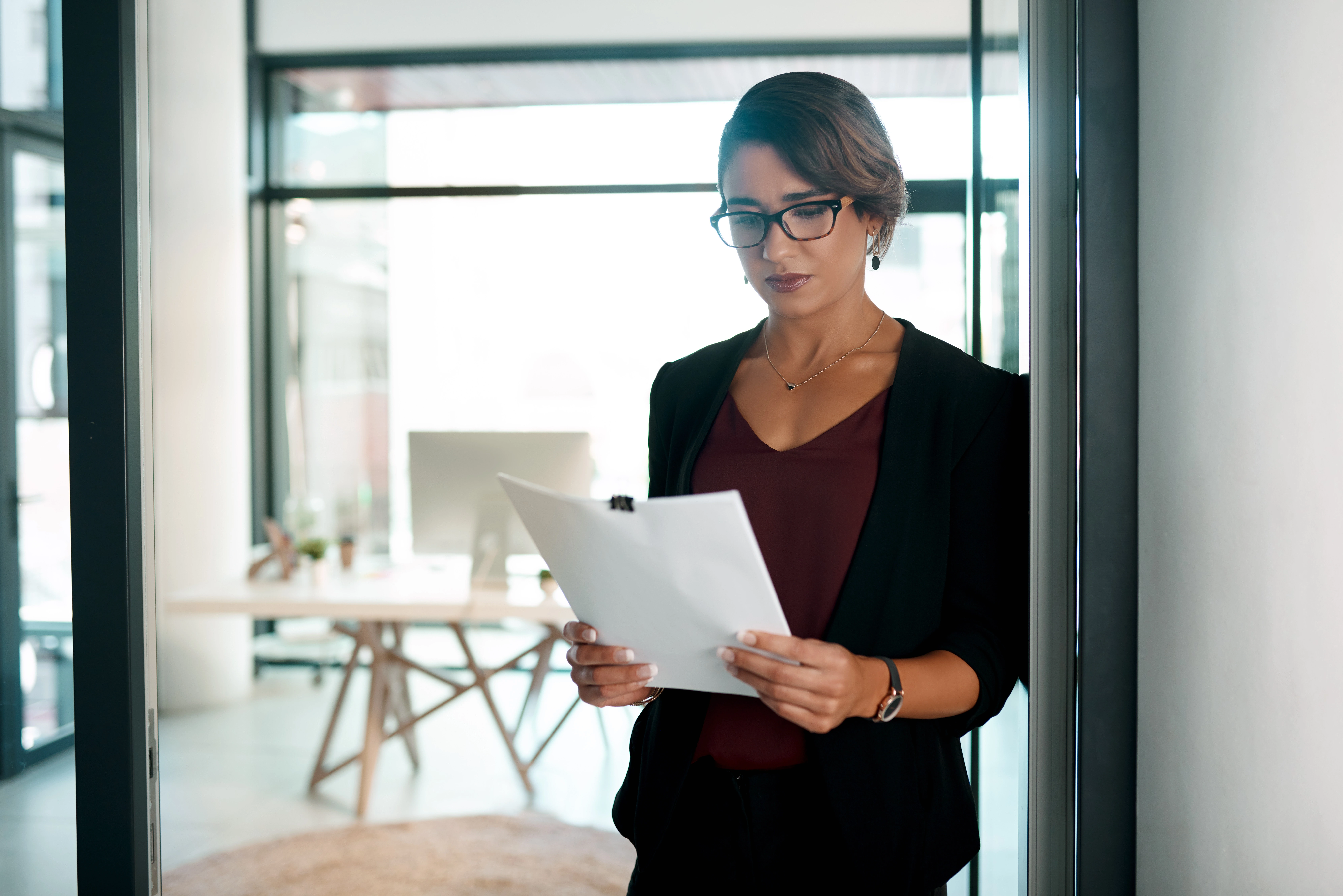 HR professional updating an internal mobility policy document on a company portal