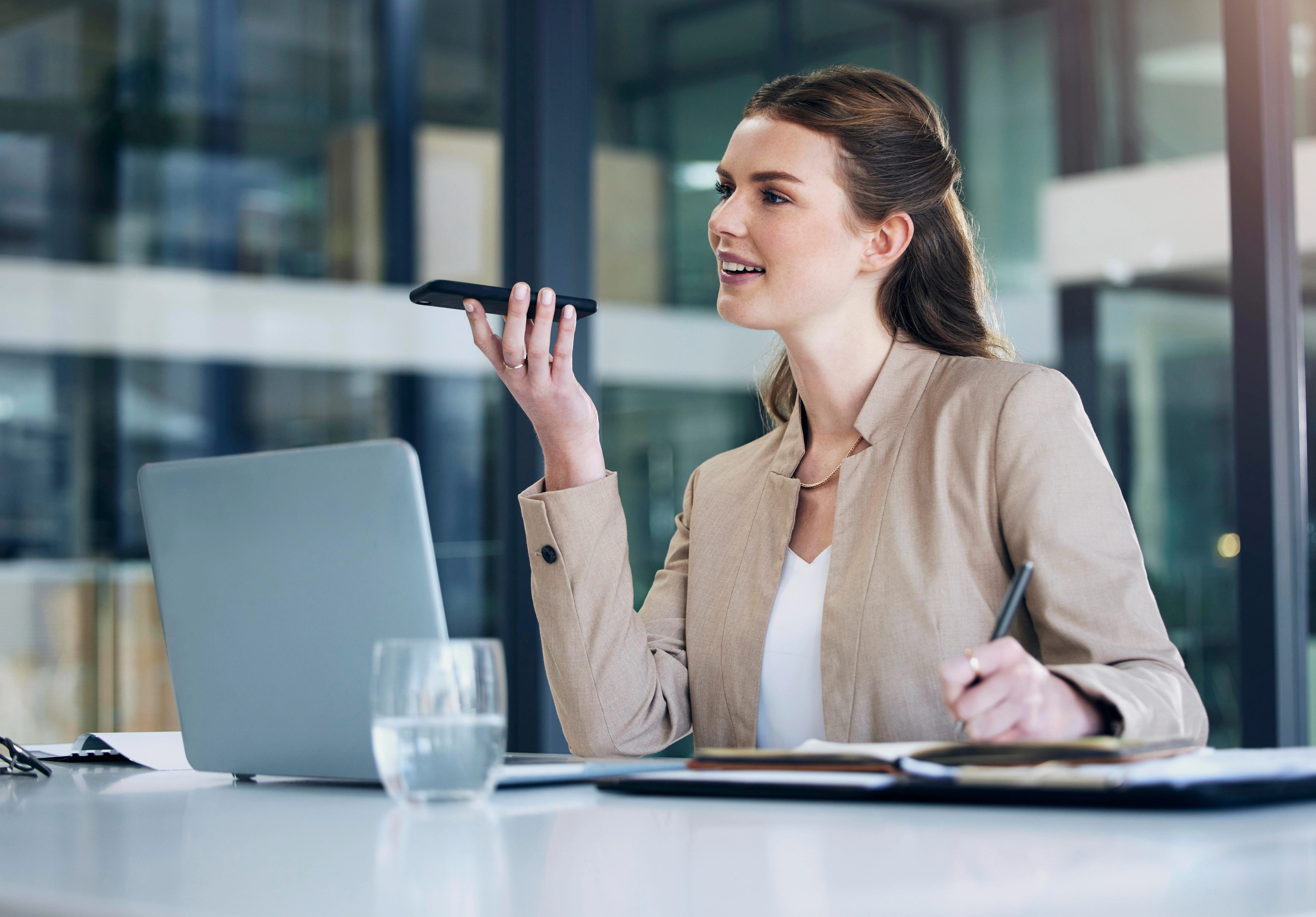 Employee using voice recognition software to navigate a digital workspace, illustrating AI-driven accessibility tools