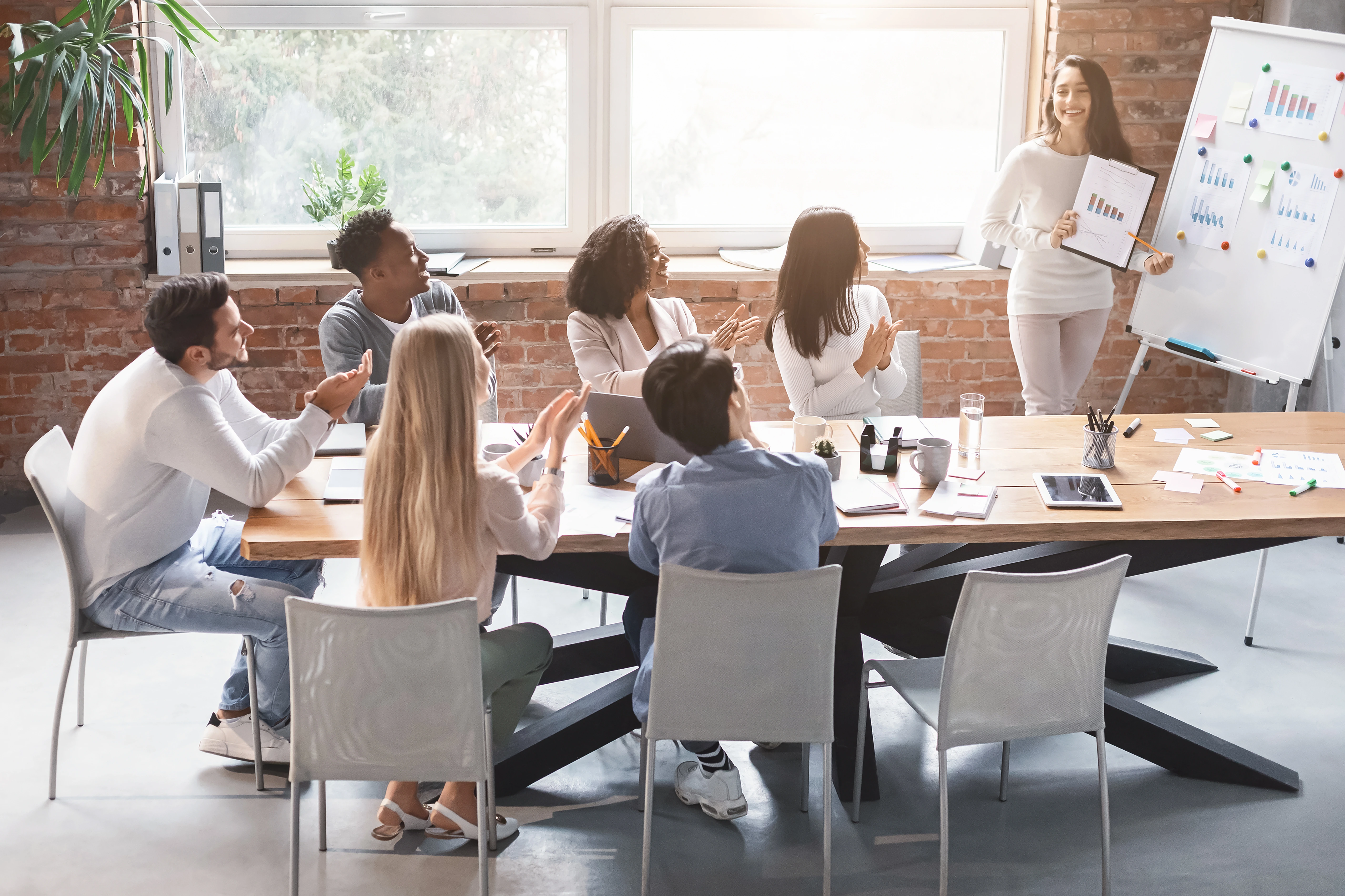 Company team meeting focused on improving employee retention strategies