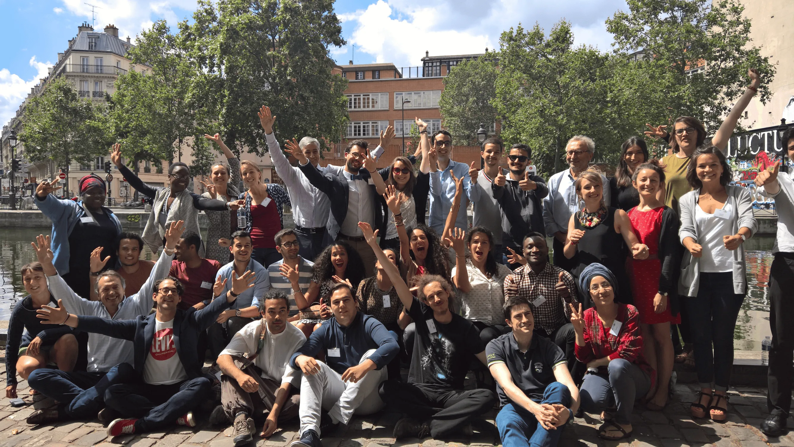 group of young people who raise their arms
