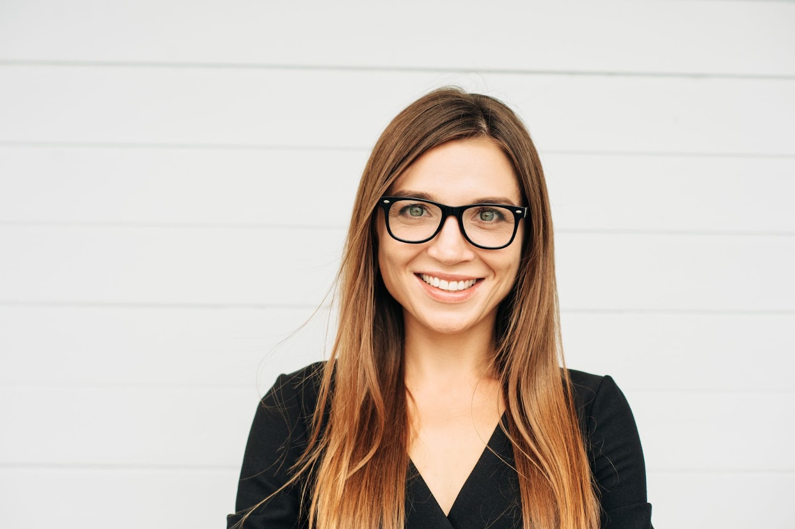 Smiling woman with straight white teeth representing smile makeover results in Upminster, Essex.