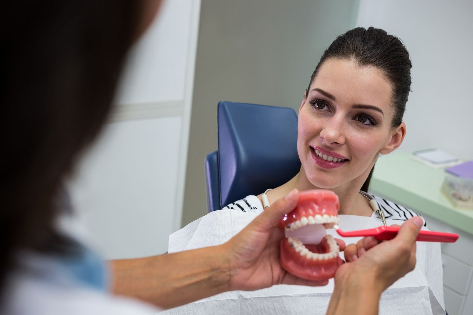 Upminster dental hygienist demonstrating correct tooth brushing technique at Church View Dental