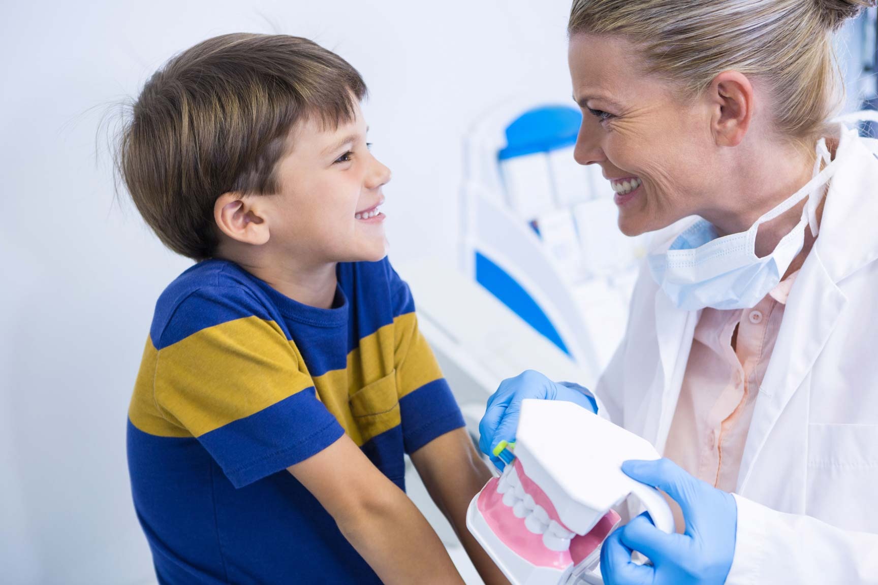 Child attending NHS dental check-up with friendly dentist in Upminster family dental practice