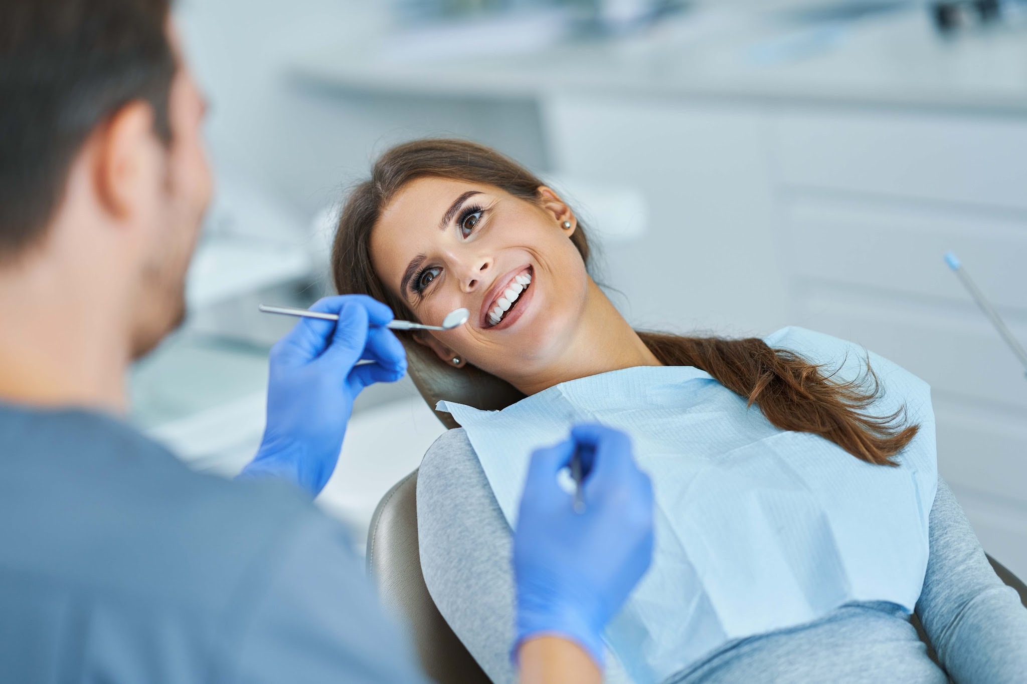 Relaxed patient smiling during a gentle dental check-up in Upminster