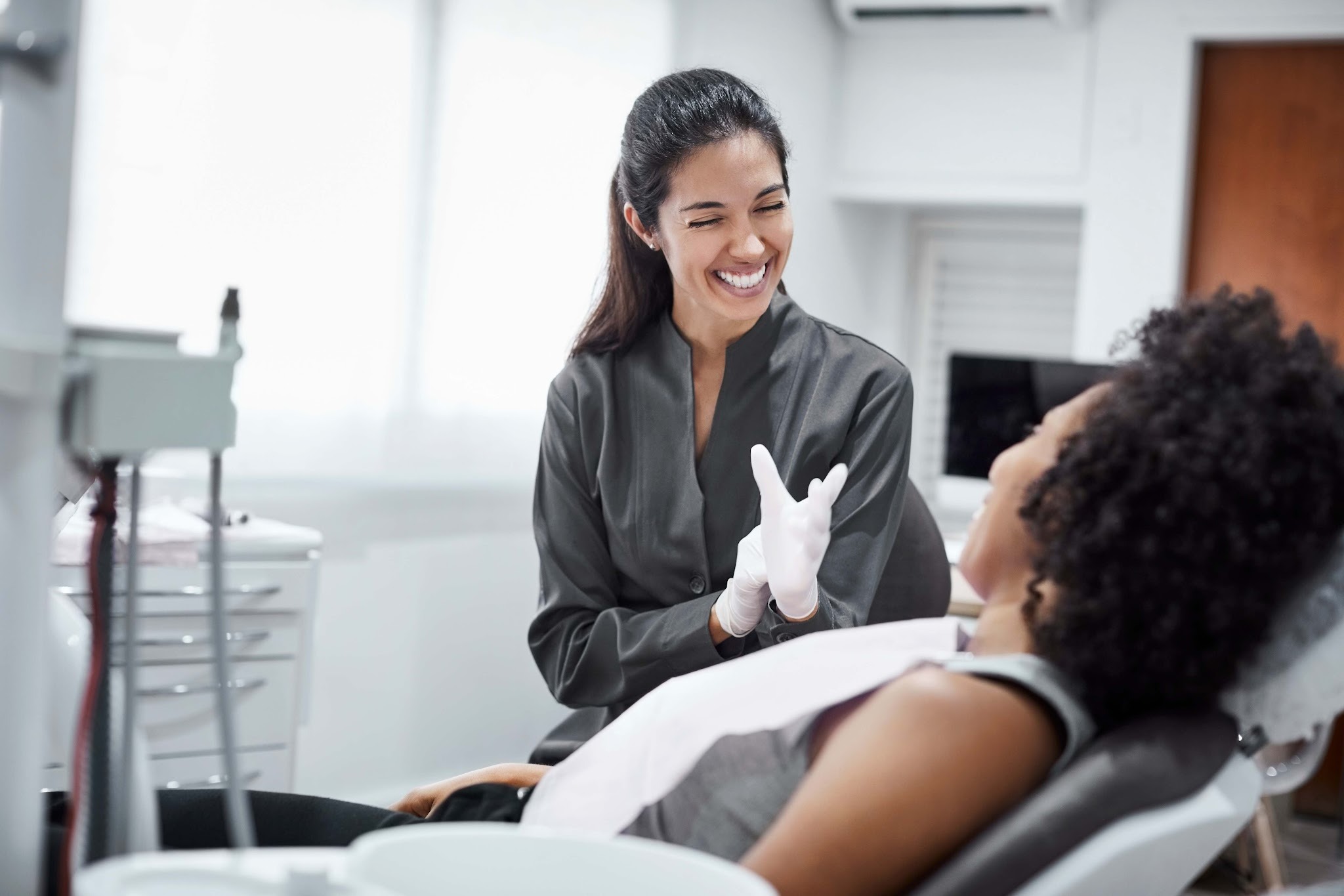 Gentle dentist in Upminster reassuring a nervous patient during a calm consultation