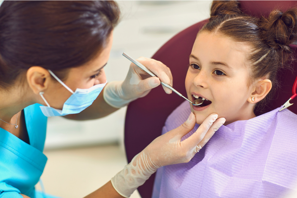 Young child having a routine dental check-up with a children's dentist in Upminster