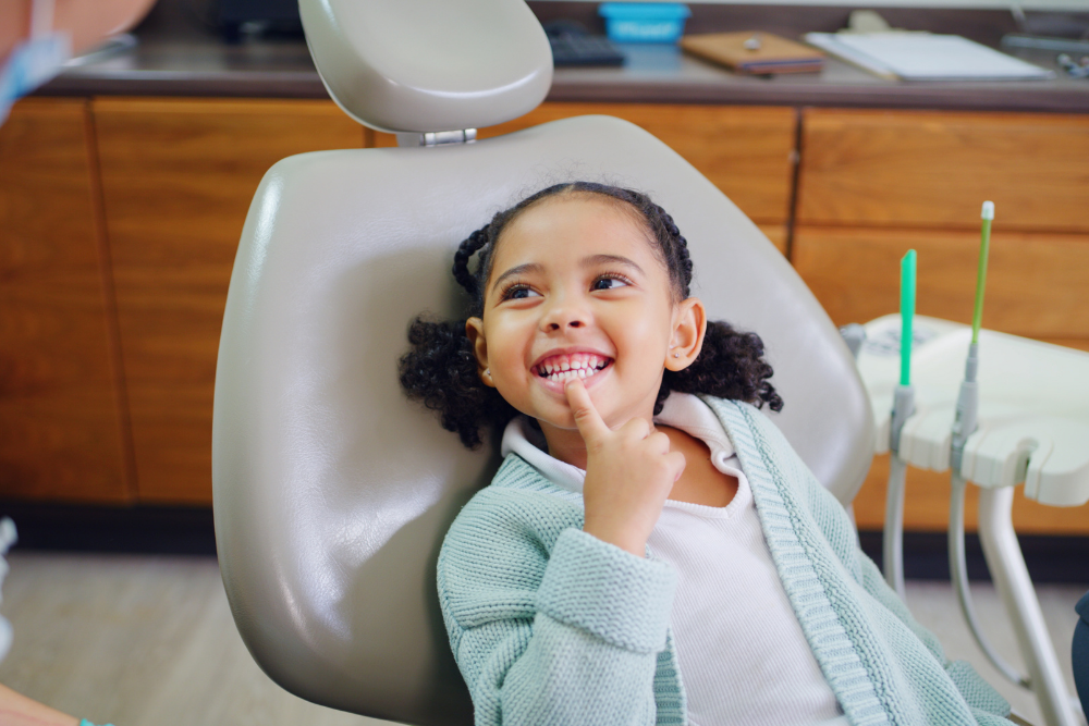 Young child smiling confidently during a dental appointment at Church View Dental