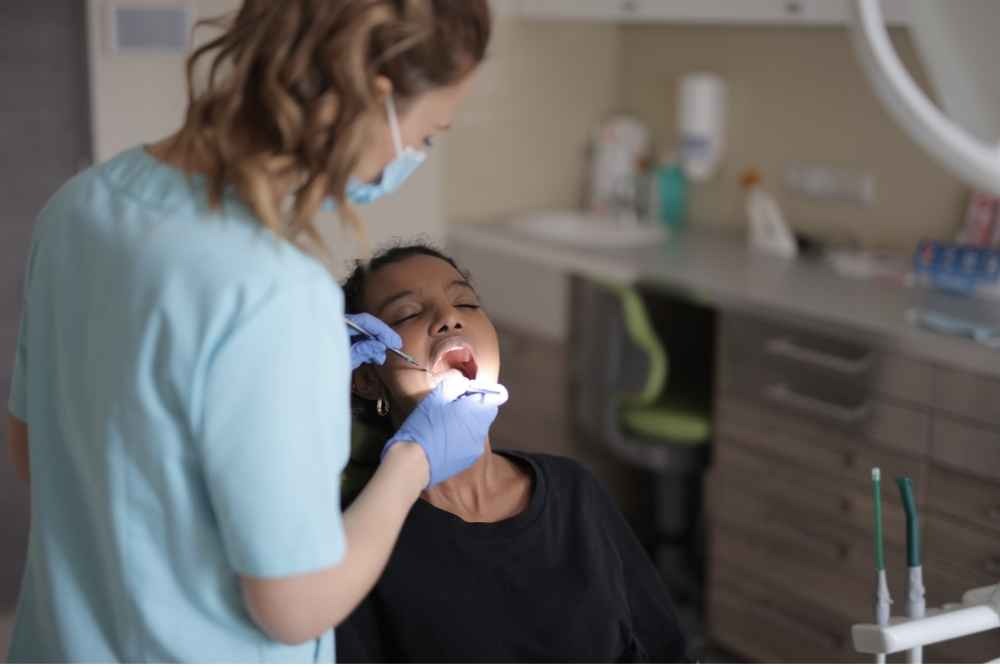 Dentist carrying out dental treatment on a patient