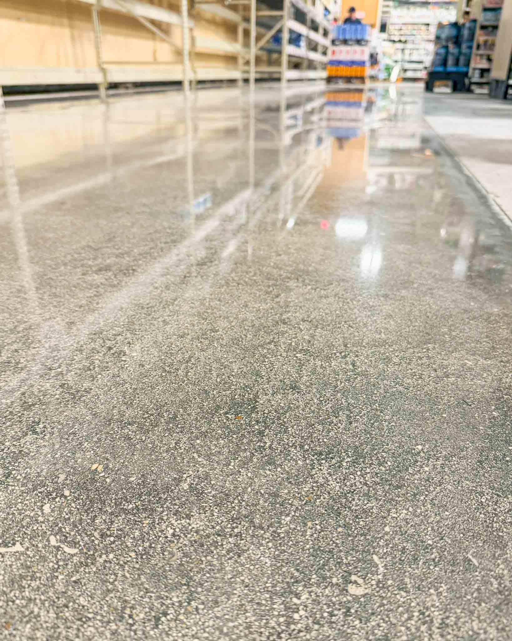 Finished polished concrete floor in an active commercial retail environment.
