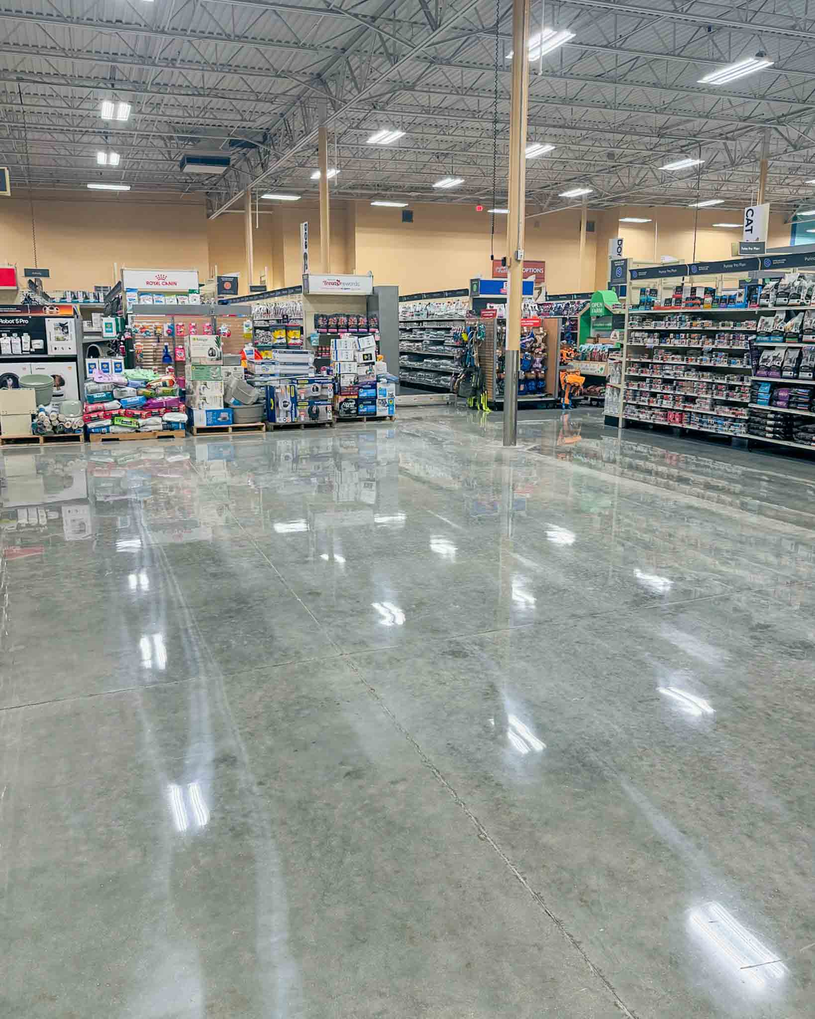 Finished polished concrete floor in an active commercial retail environment.