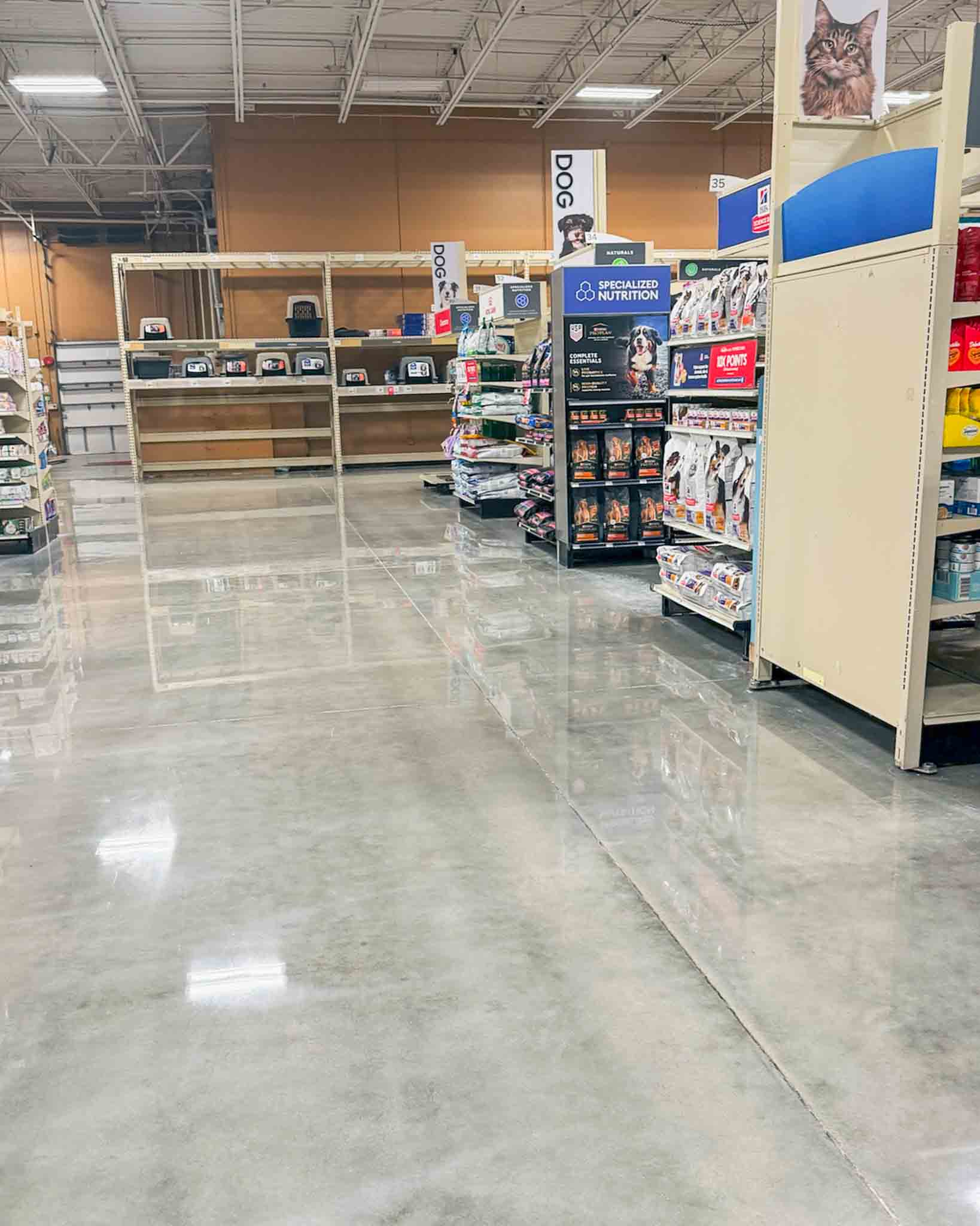 Finished polished concrete floor in an active commercial retail environment.