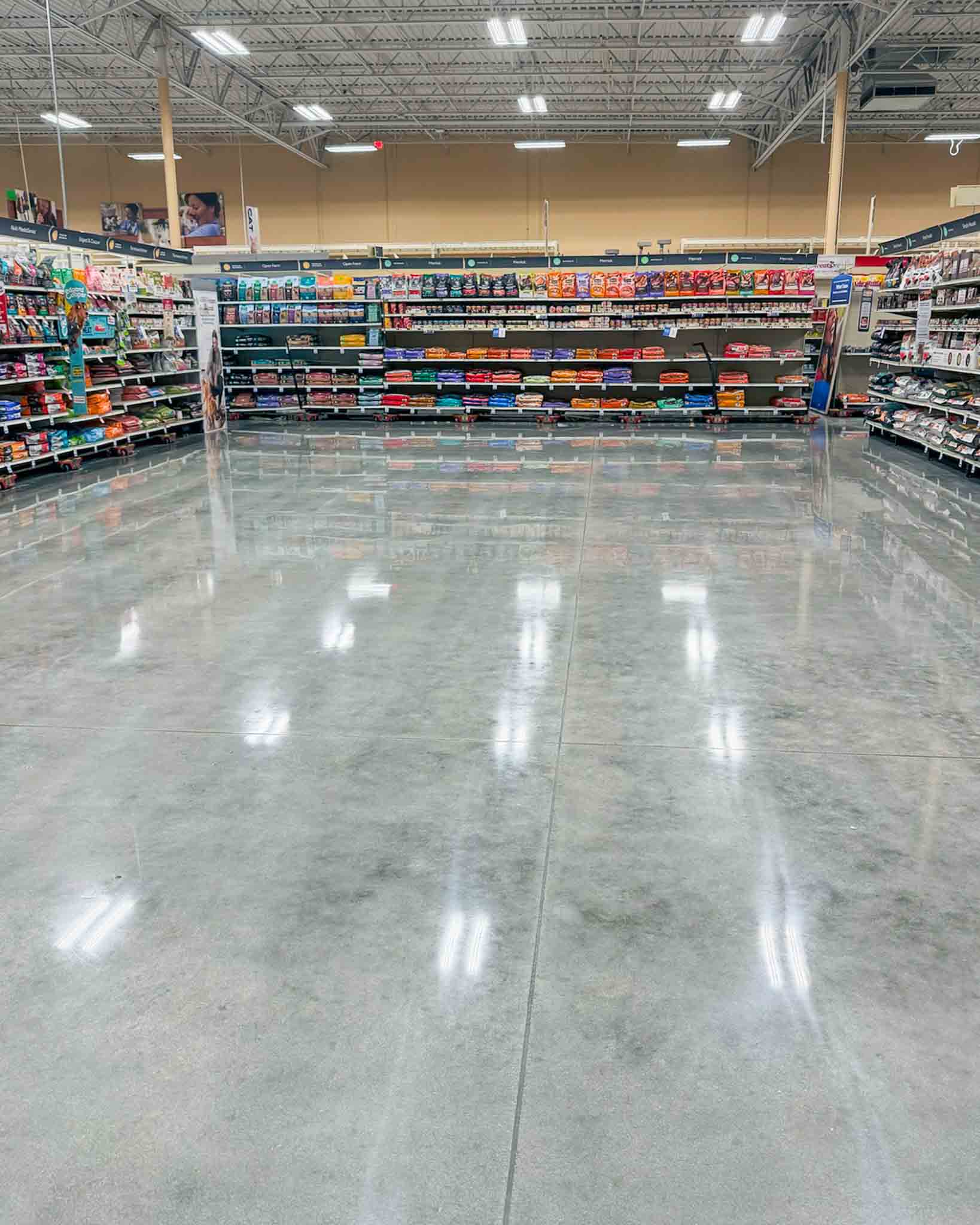 Finished polished concrete floor in an active commercial retail environment.